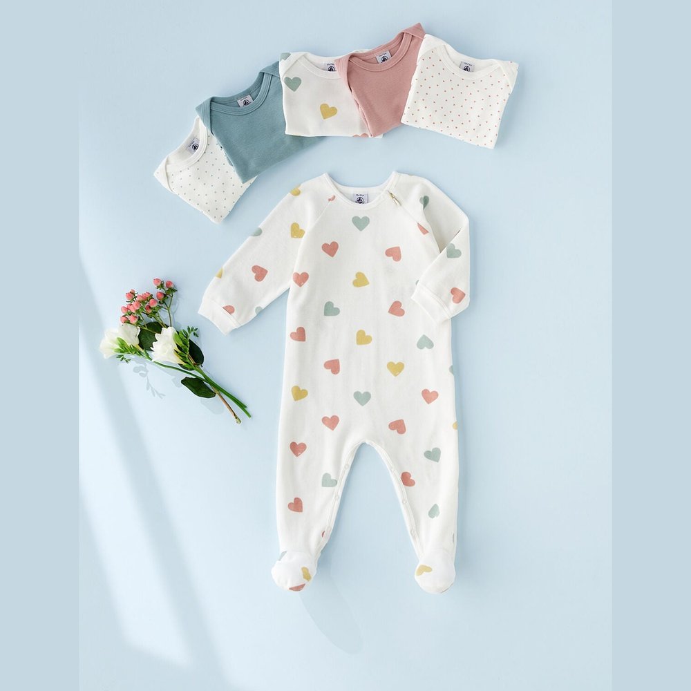 Velvet baby pyjamas with multicolored heart print